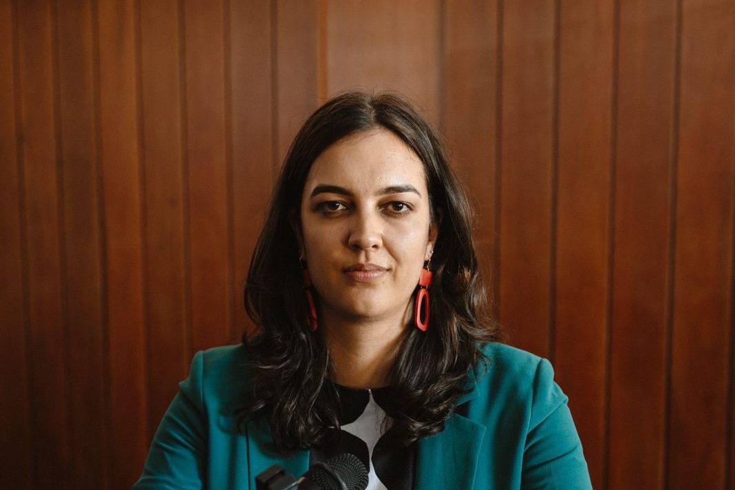 A woman speaking at a lectern